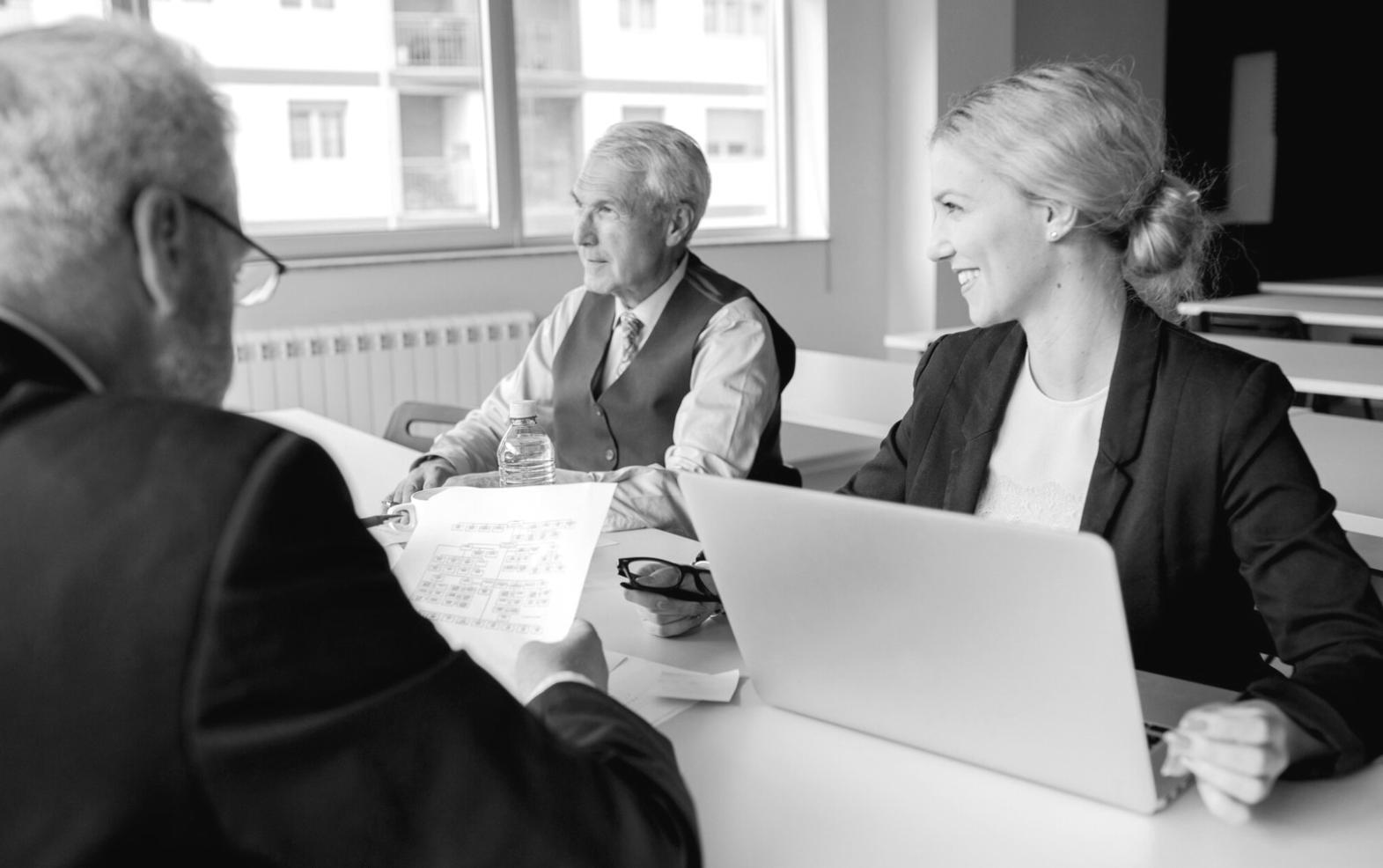 Business professionals reviewing financial documents together